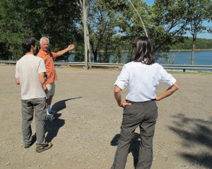 Harry visiting with Chuck Dovish at Lake Alma as trail volunteer,Laura Seal, looks on. 