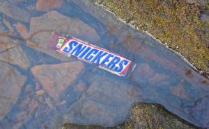 Snickers bar cooling in a small stream.  
