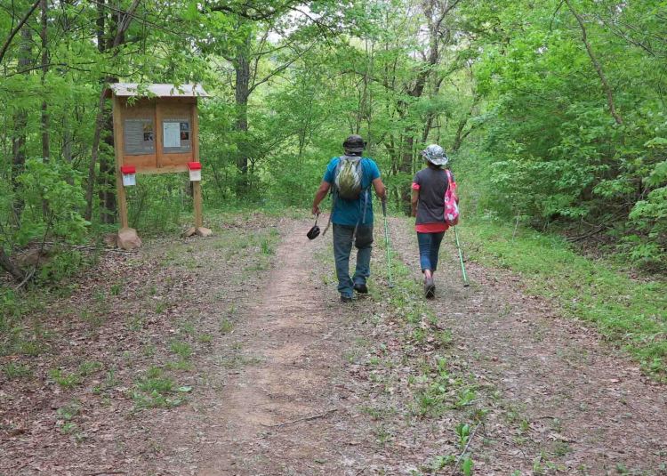 Two hikers beginning their hike. 